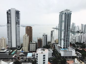 High angle view of buildings in city against sky