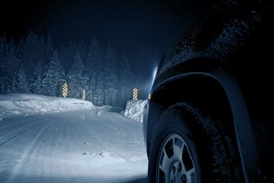 Car on snow covered street 