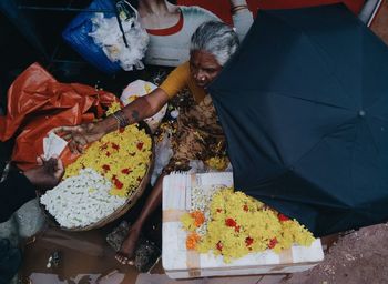 High angle view of people holding food