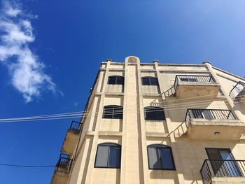 Low angle view of building against blue sky