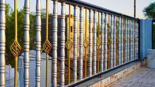 Beautiful decorative cast metal wrought fence with artistic forging. iron guardrail close up. golden