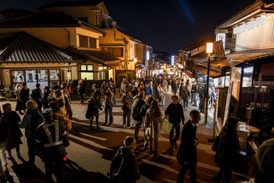 People walking on street at night