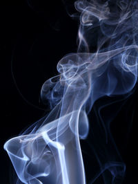 Close-up of smoke against black background