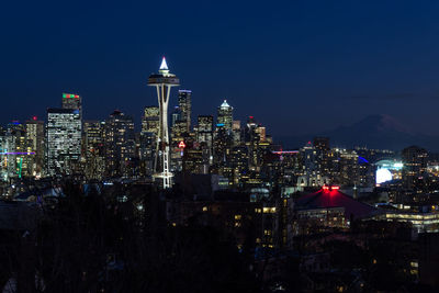 Illuminated buildings in city at night