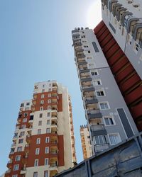 Low angle view of buildings against blue sky