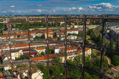 High angle view of buildings in city against sky