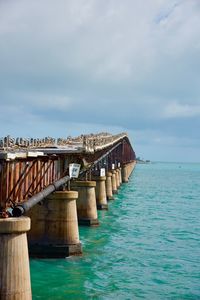 Pier over sea against sky