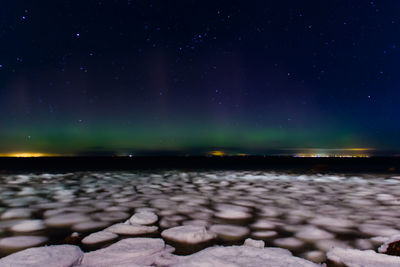 Scenic view of sea against sky at night