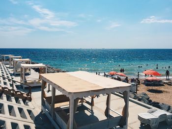 Beds at beach during sunny day