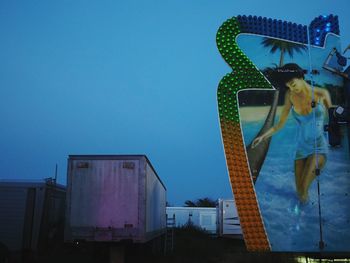 Low angle view of statue against clear blue sky