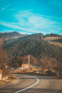 Trees and mountains against sky