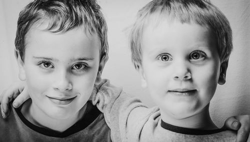 Two brothers posing for a portrait in my home studio in black and white