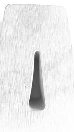 Umbrella against white wall