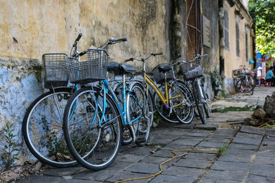 Bicycles parked on footpath outside building