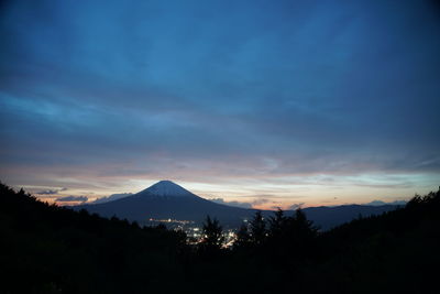 Scenic view of silhouette mountains against sky during sunset