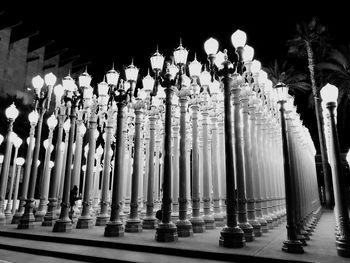 Row of illuminated lights on building