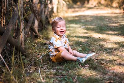 Cute girl sitting on grass