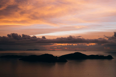 Scenic view of sea against romantic sky at sunset