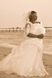 Woman with umbrella on beach