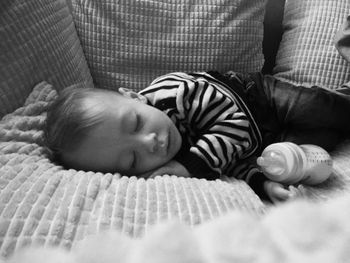 Close-up of baby boy sleeping in bed at home