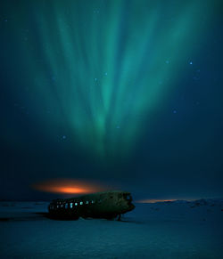 Scenic view of sea against sky at night