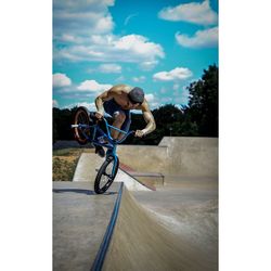 Man riding bicycle on road