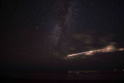 Scenic view of star field against sky at night