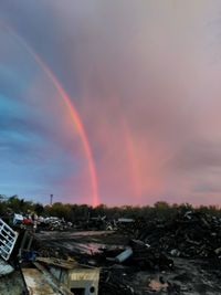 Scenic view of rainbow over town