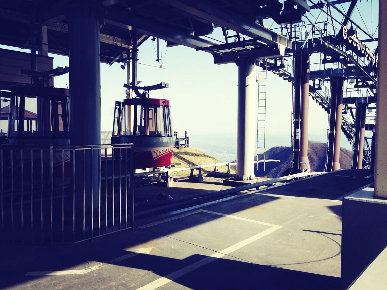 built structure, architecture, transportation, sunlight, metal, sky, sea, indoors, empty, day, industry, no people, clear sky, harbor, mode of transport, shadow, architectural column, travel, building exterior