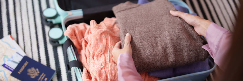 Cropped hand of woman holding food