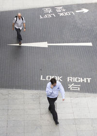 High angle view of people standing on street