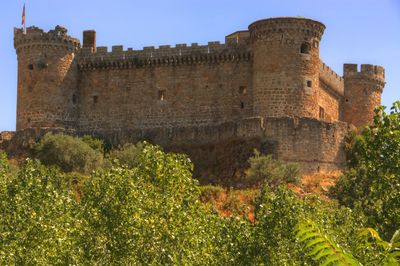 Low angle view of fort against clear sky