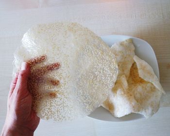 Close-up of hand holding ice cream