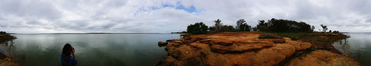 Scenic view of sea against cloudy sky