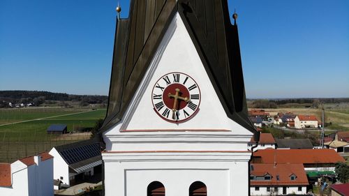 Clock tower against sky in city