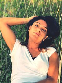 Portrait of young woman standing on land