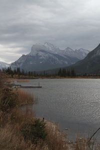 Scenic view of lake and mountains against sky