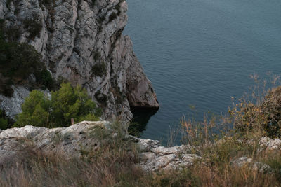 High angle view of rocks by sea