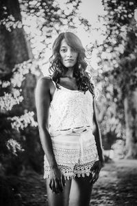 Portrait of young woman standing outdoors