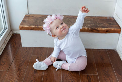 High angle view of cute girl playing with teddy bear