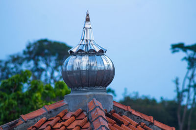 The dome of the mosque on a tile with a sky background