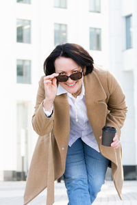 Young woman using smart phone outdoors