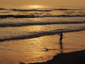 Scenic view of sea at sunset