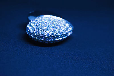 Close-up of blue glass on table