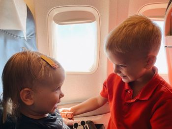 Close-up of cute kids on a plane
