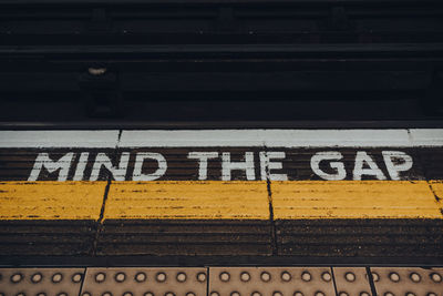 Text on railroad station platform