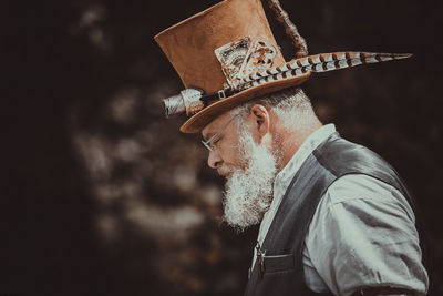 Man wearing hat while standing outdoors