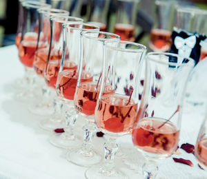 Close-up of wine glasses on table