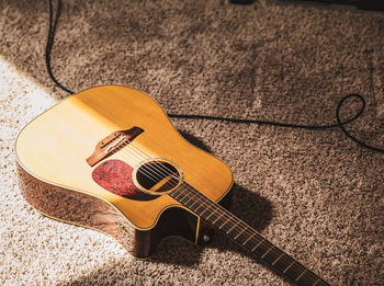 High angle view of guitar on table