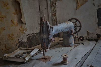 Rusty machine in abandoned room